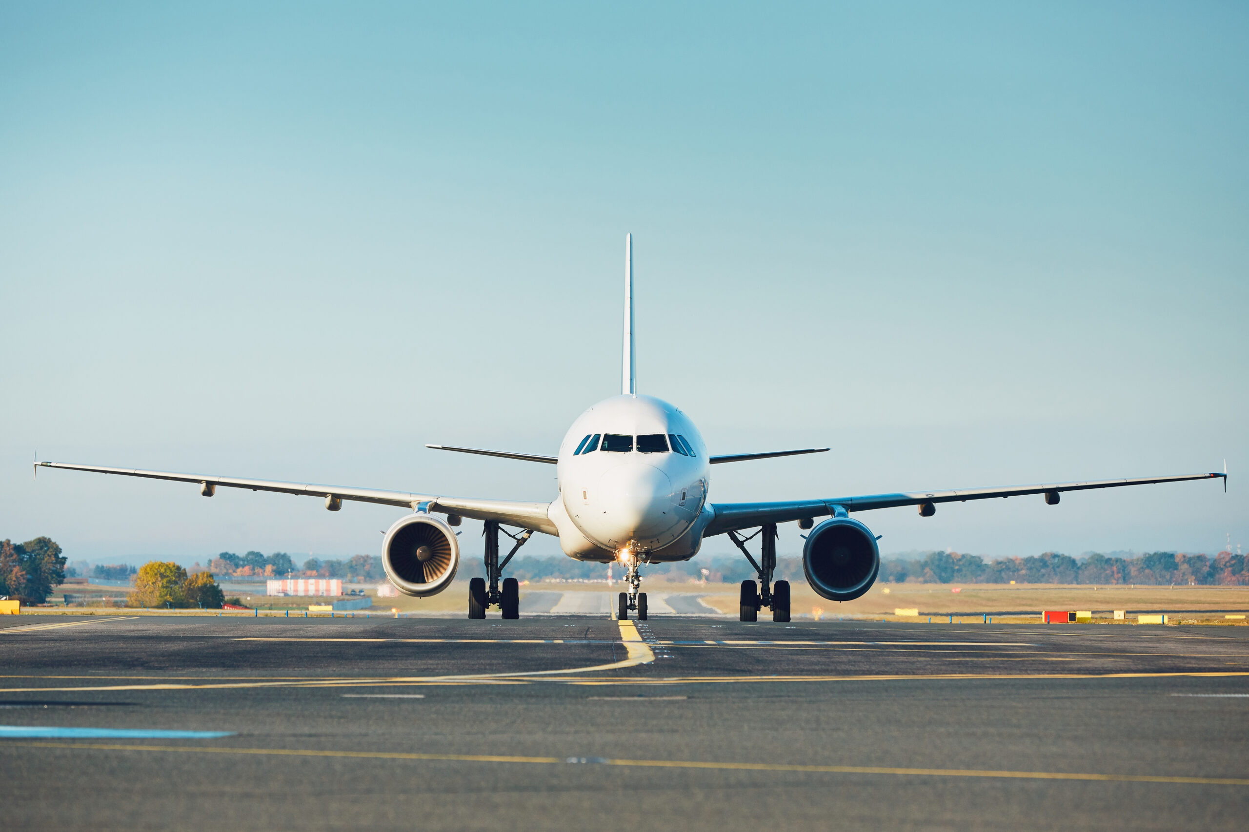 Traffic at the airport. Airplane is taxiing to the runway.
